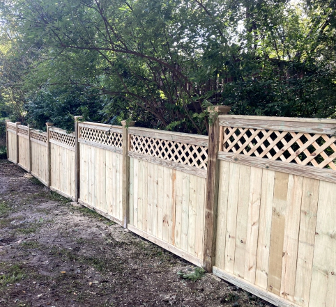 custom made fence with criss cross patten at the top